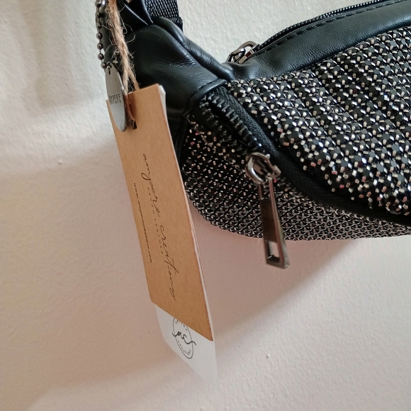 Sleek Black and Silver Satchel with Modern Design - Picture 4 of 7